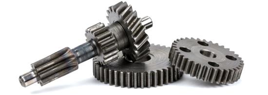 3 steel gears laying on one another